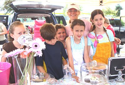 Marion Cardwell-Ferrer with young bakers at the Lansing Farmer's Market